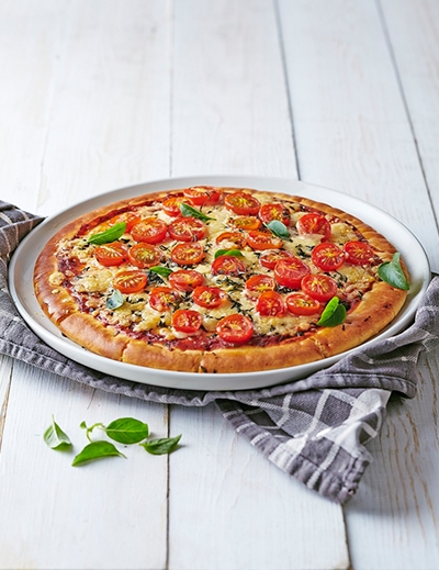 Pizza with charred cherry tomatoes and gouda